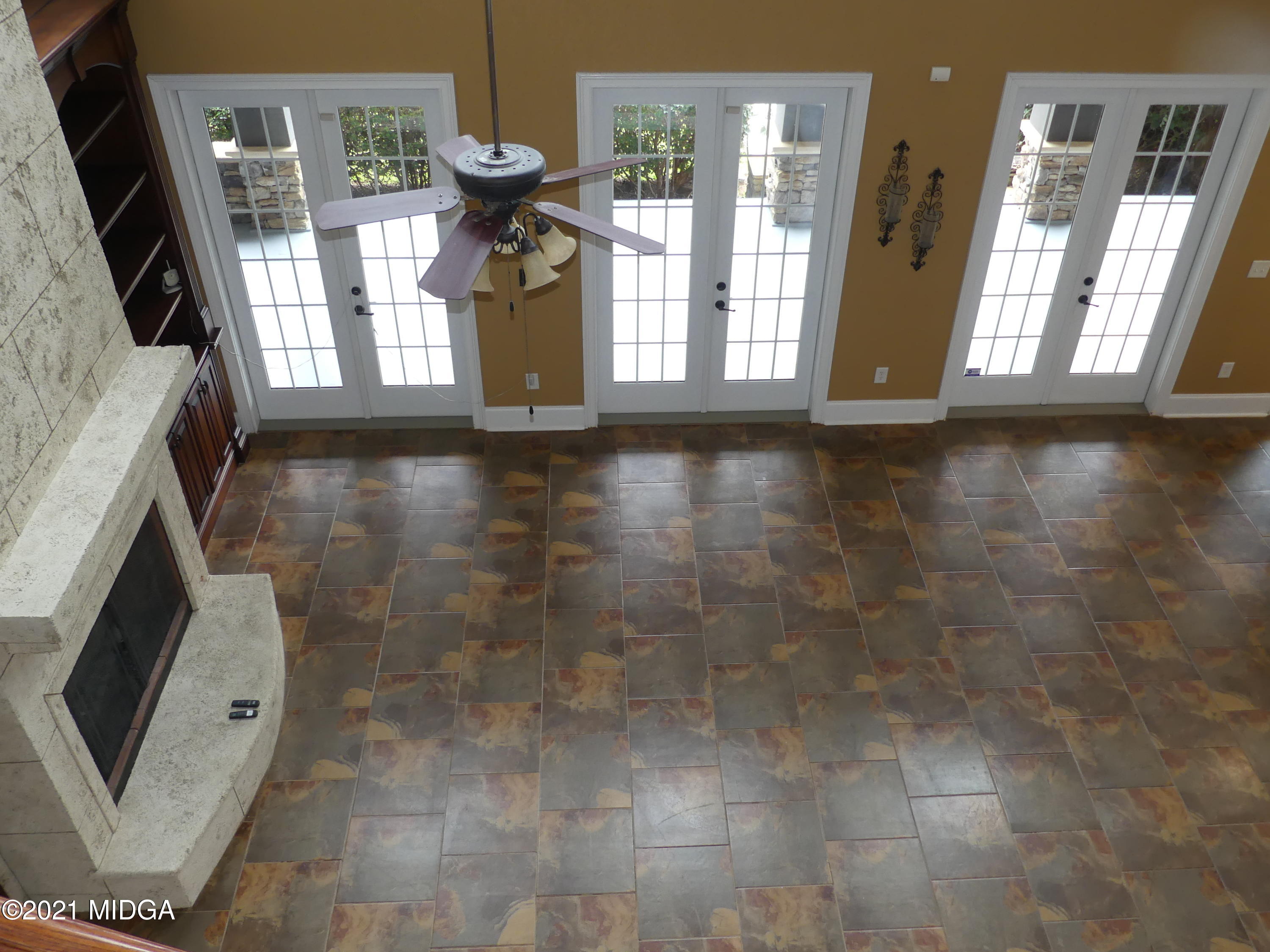 1616 Wadley Road Macon, GA 31220 - Photo 17 of 56 a view of an entryway with wooden floor and a fireplace