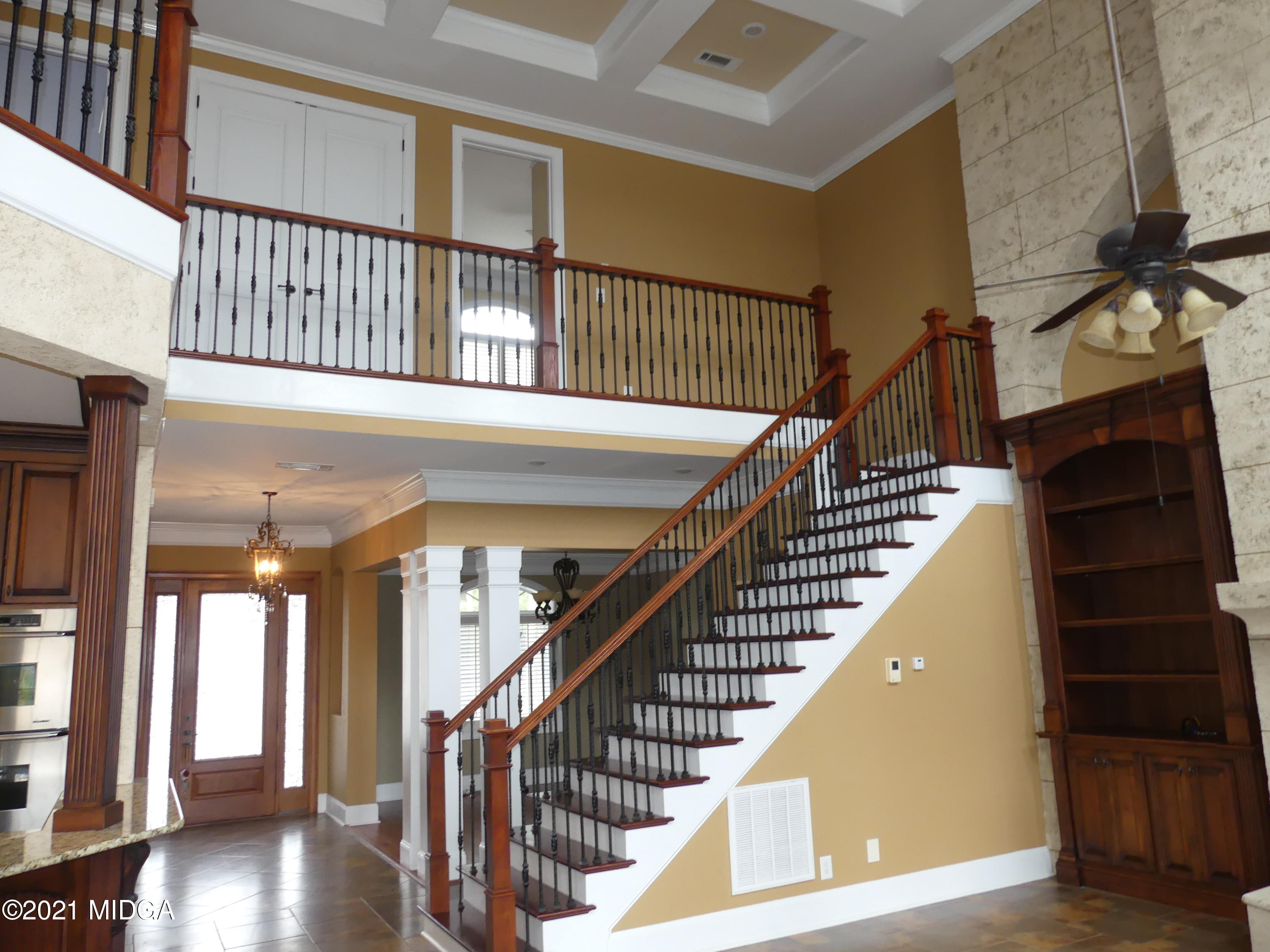 1616 Wadley Road Macon, GA 31220 - Photo 19 of 56 a view of staircase with lots of frames on wall and a window