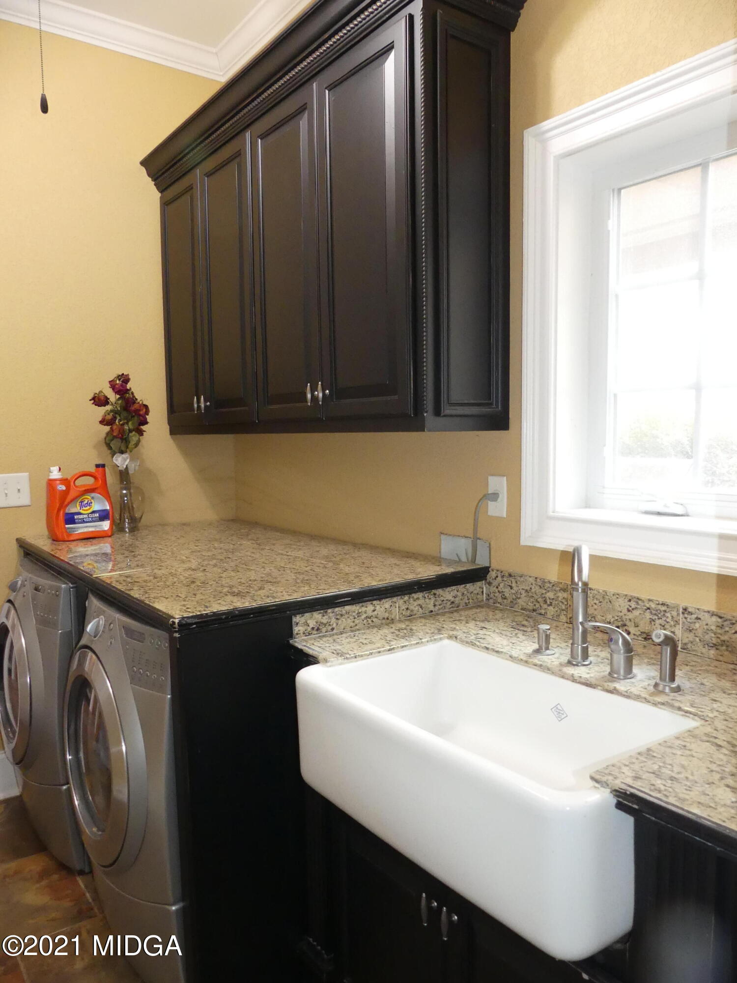 1616 Wadley Road Macon, GA 31220 - Photo 20 of 56 a bathroom with a sink and a washing machine