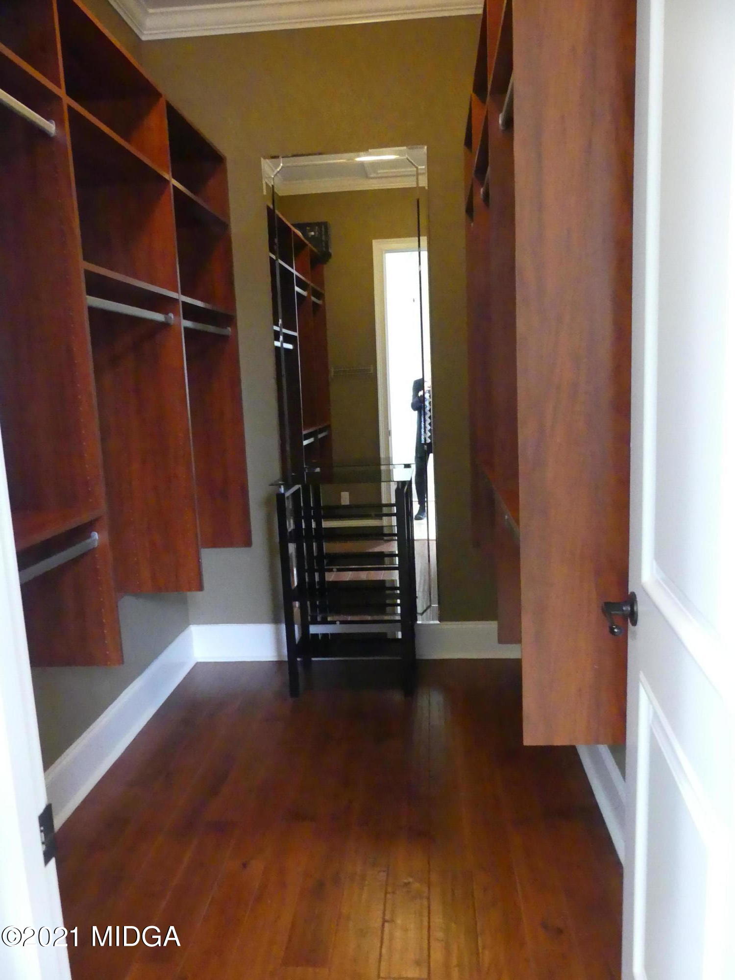 1616 Wadley Road Macon, GA 31220 - Photo 29 of 56 a view of walk in closet with clothes and shoes