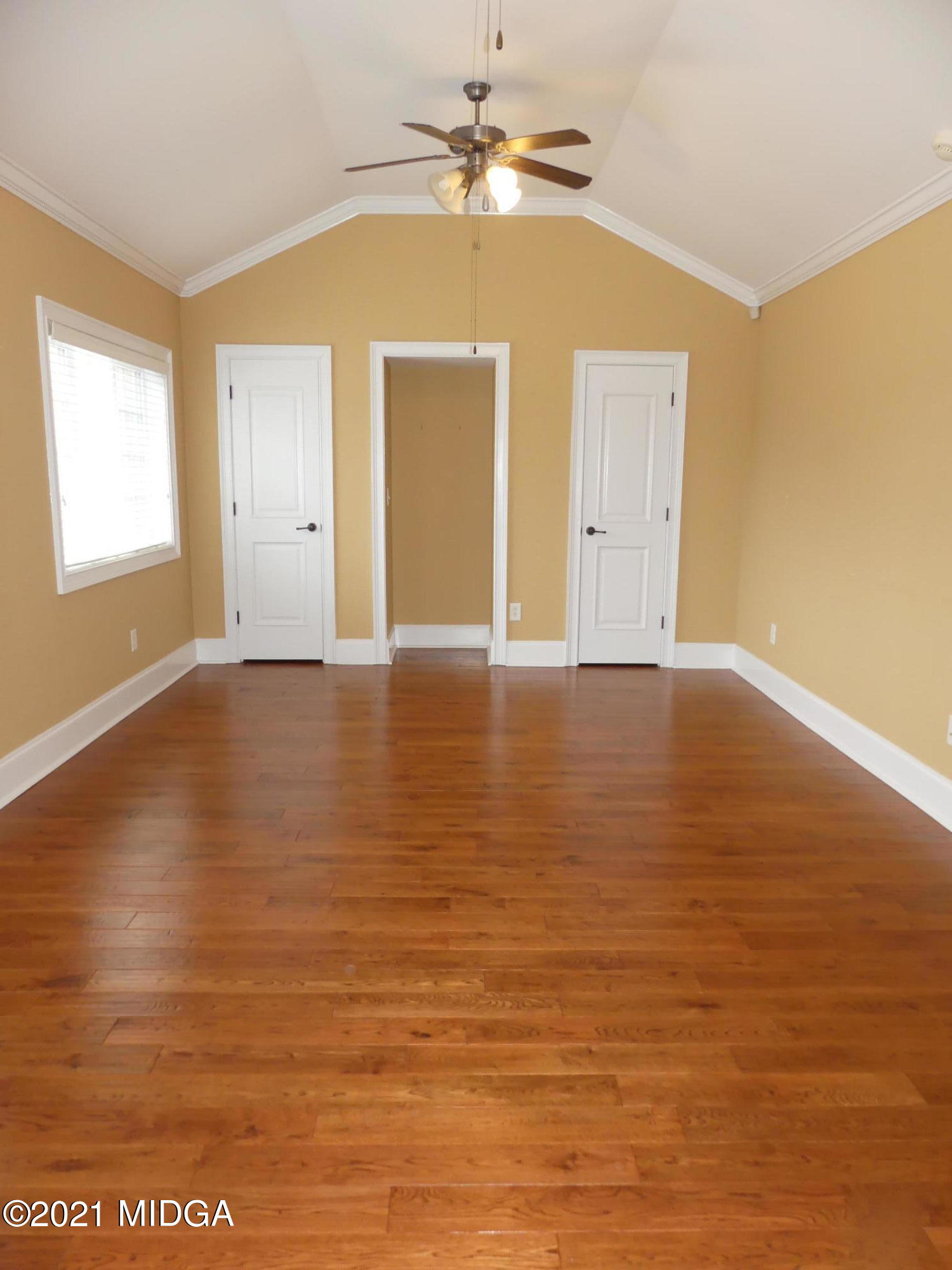 1616 Wadley Road Macon, GA 31220 - Photo 33 of 56 a view of an empty room with window and wooden floor