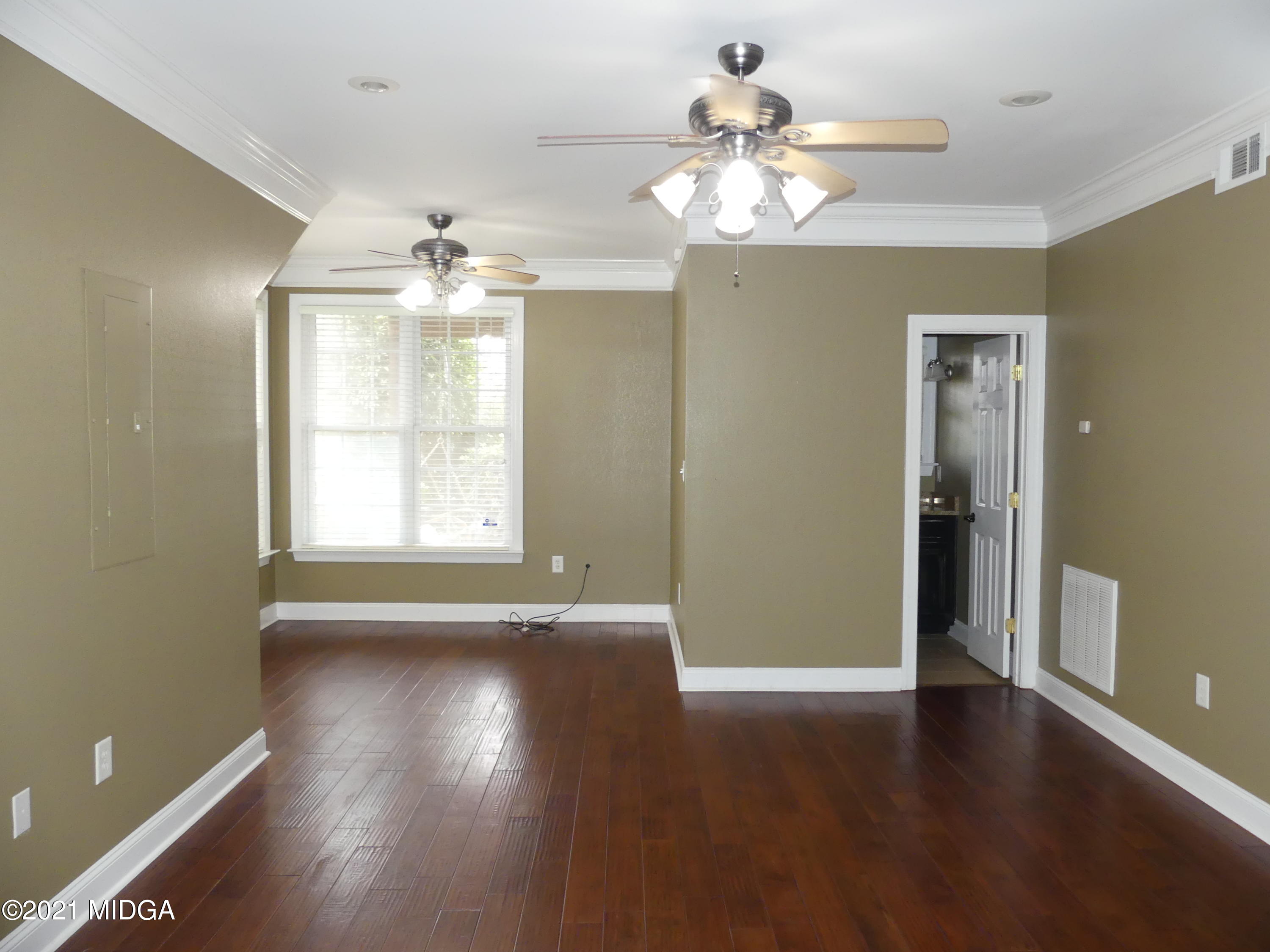1616 Wadley Road Macon, GA 31220 - Photo 38 of 56 wooden floor in an empty room with a window