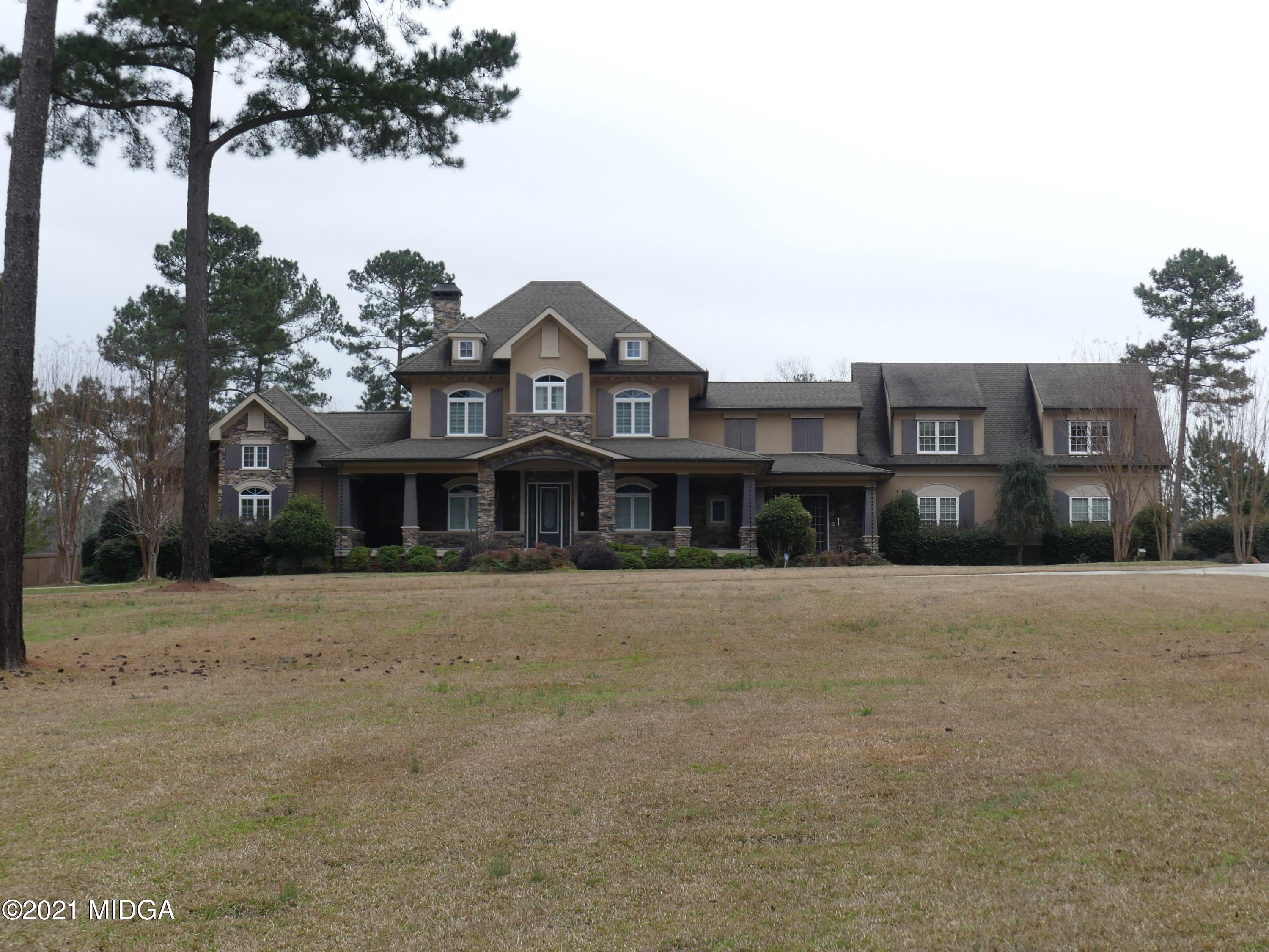 1616 Wadley Road Macon, GA 31220 - Photo 46 of 56 a front view of a house with a yard and garage