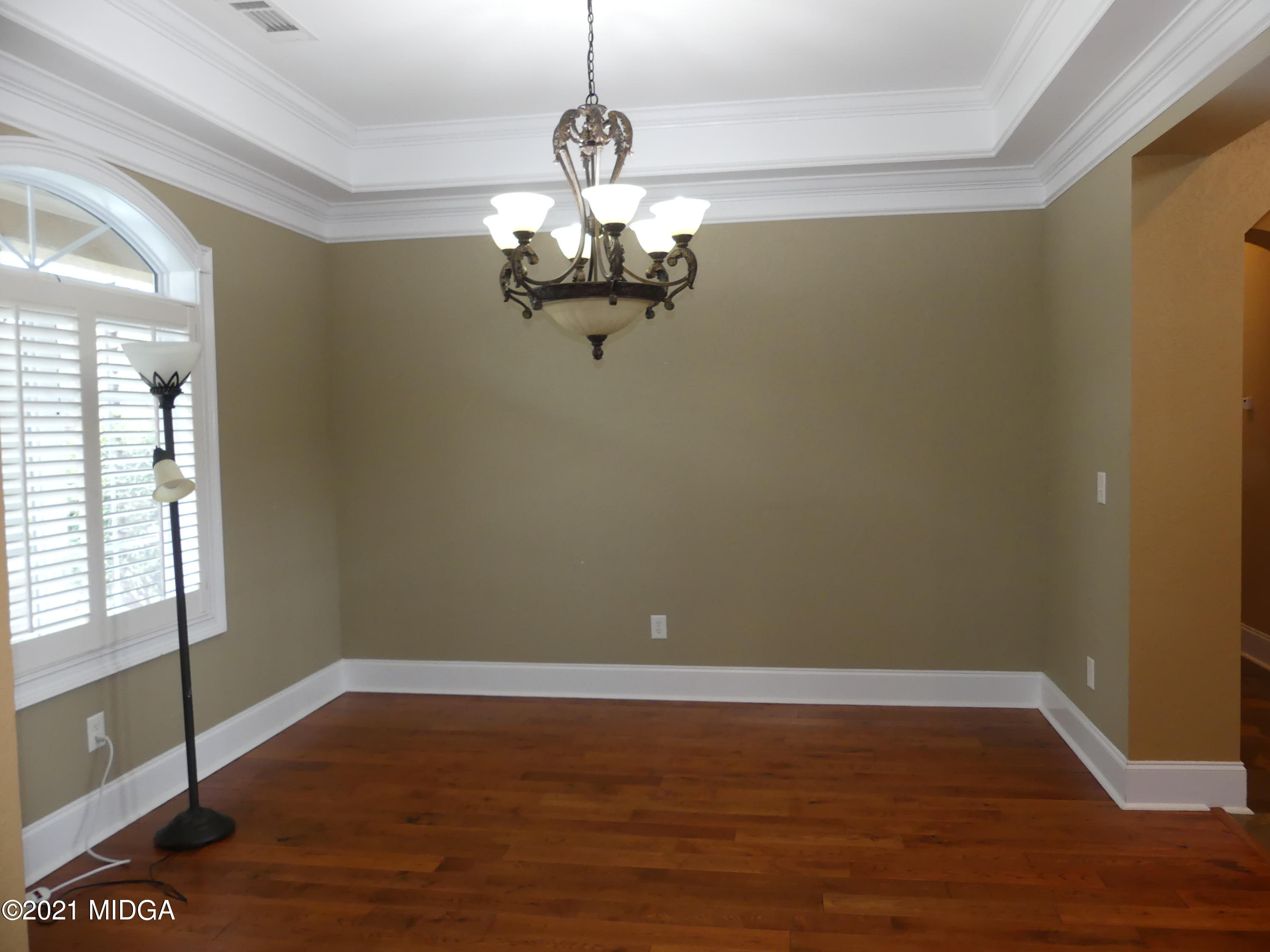 1616 Wadley Road Macon, GA 31220 - Photo 6 of 56 a view of a room with wooden floor and chandelier
