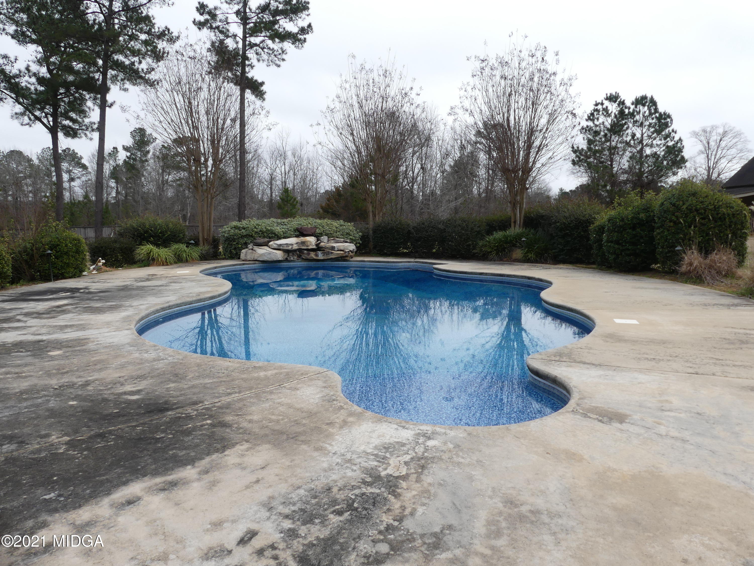 1616 Wadley Road Macon, GA 31220 - Photo 51 of 56 a view of backyard with swimming pool and seating space