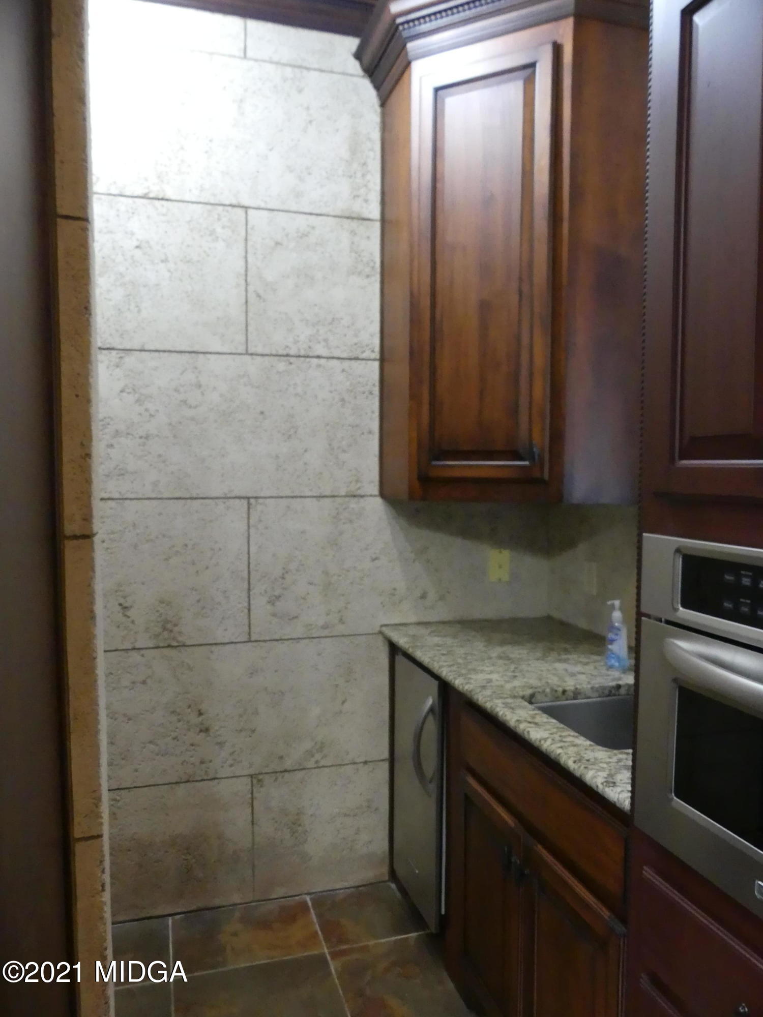 1616 Wadley Road Macon, GA 31220 - Photo 10 of 56 a bathroom with a granite countertop sink and a washing machine