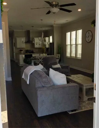 a living room with furniture and a window