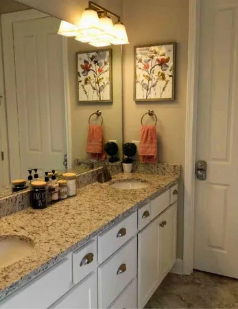 a bathroom with sinks and mirror