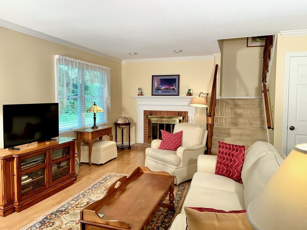 149 The Meadows, Unit 149 Enfield, CT 06082 - Photo 4 of 14 a living room with furniture and a flat screen tv
