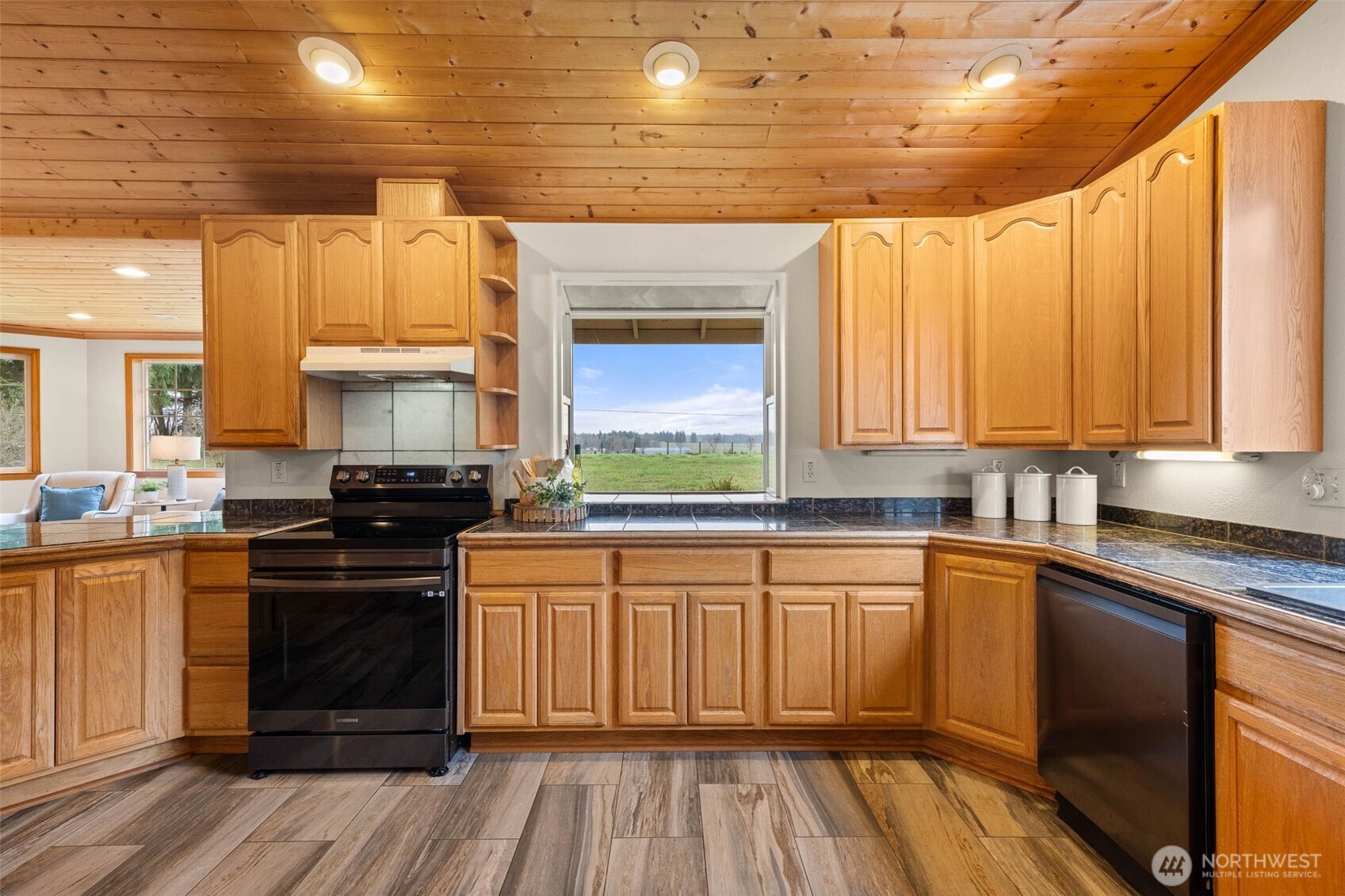 30608 40th Avenue South Roy, WA 98580 - Photo 13 of 40 a kitchen with a sink stove and cabinets