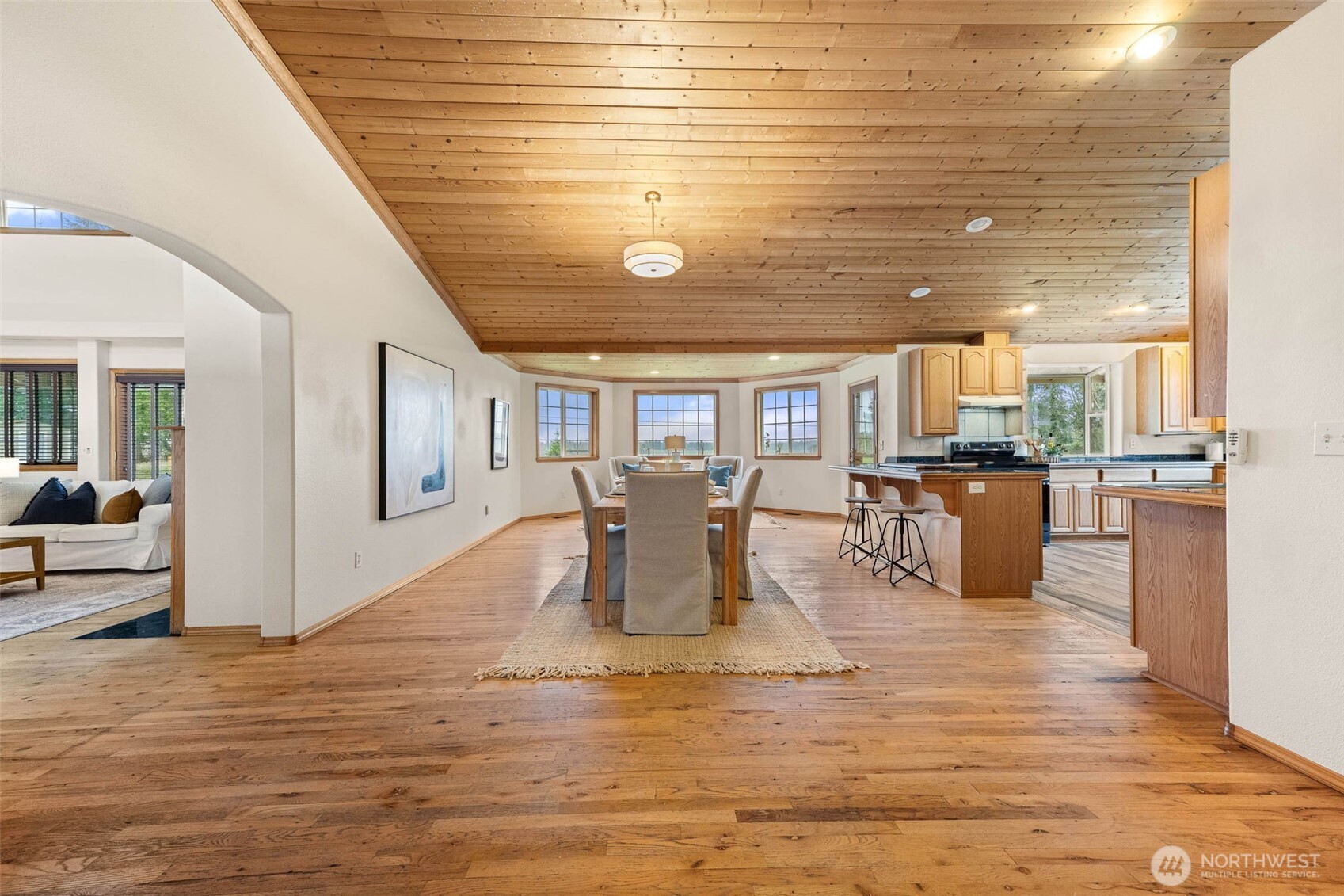 30608 40th Avenue South Roy, WA 98580 - Photo 14 of 40 a dining room with kitchen island stainless steel appliances wooden floor and living room view