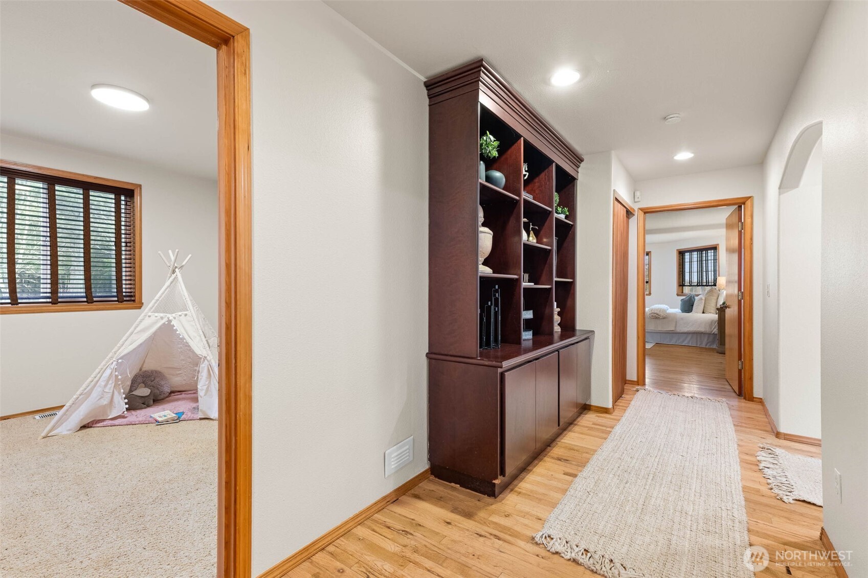 30608 40th Avenue South Roy, WA 98580 - Photo 16 of 40 a view of a hallway with wooden floor and furniture