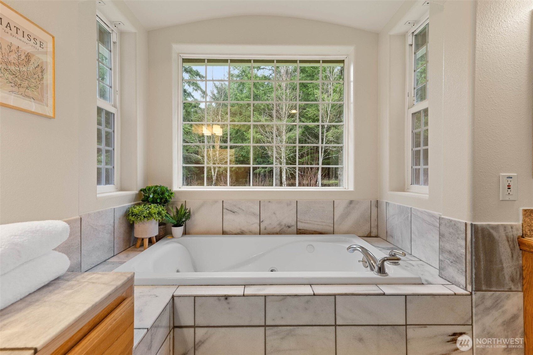 30608 40th Avenue South Roy, WA 98580 - Photo 20 of 40 a bath tub sitting in a bathroom next to a window