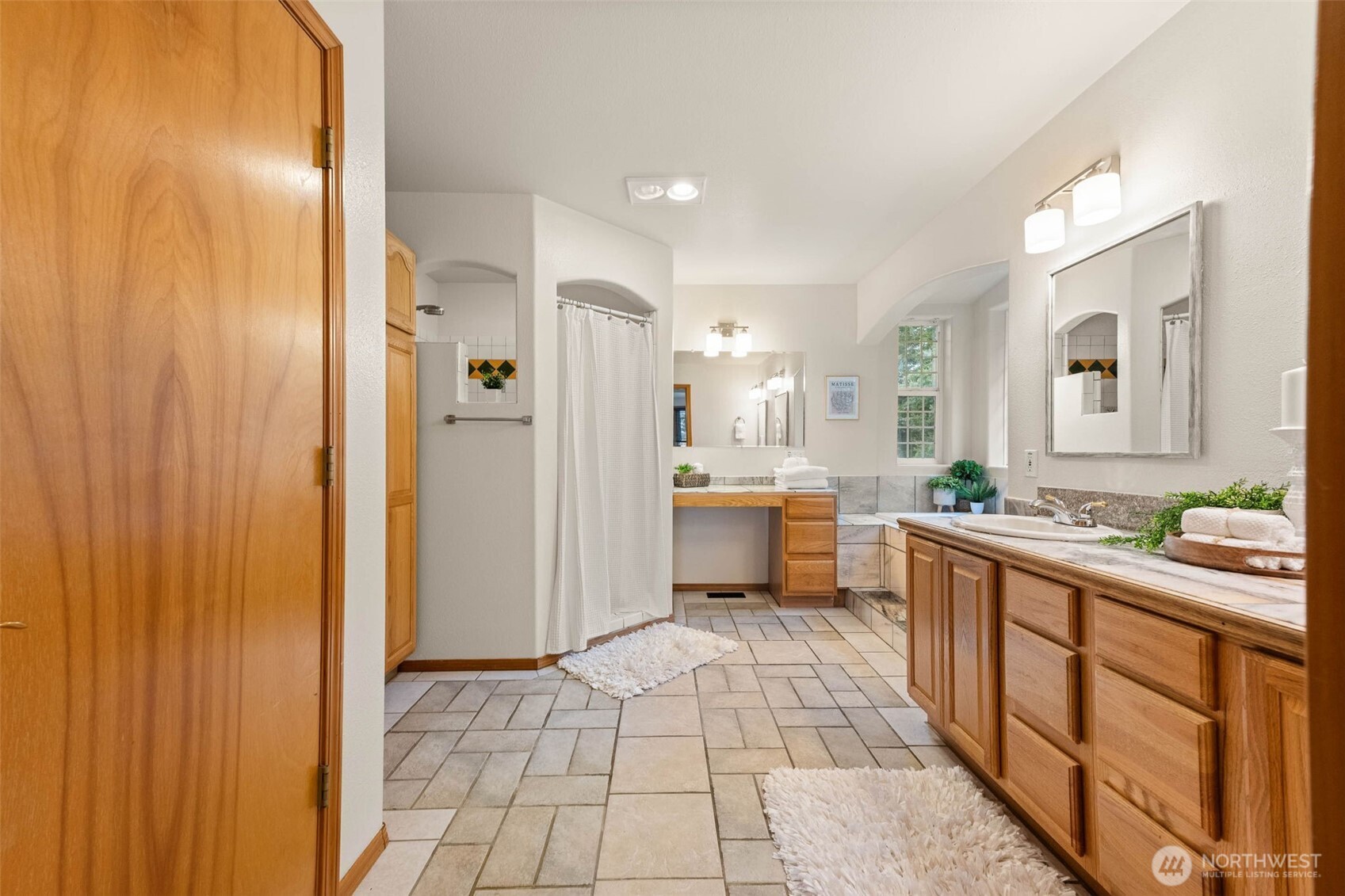 30608 40th Avenue South Roy, WA 98580 - Photo 21 of 40 a large bathroom with a glass door shower a sink and a mirror