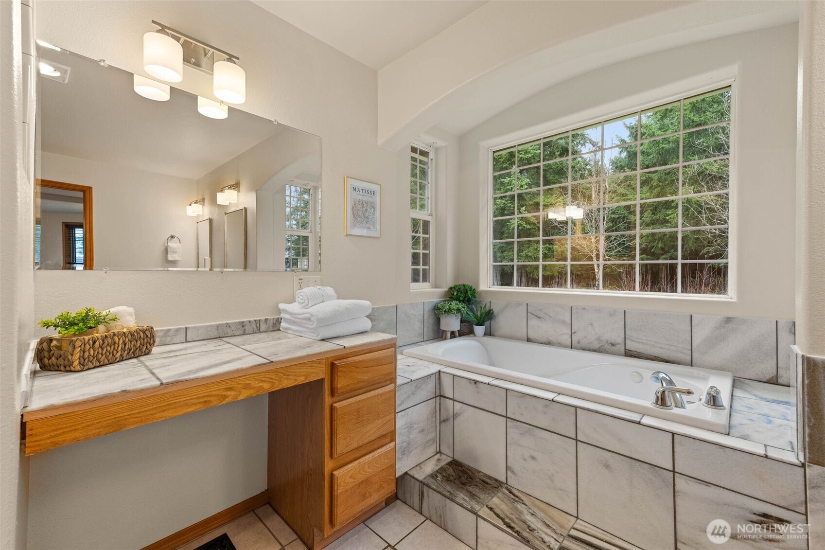 30608 40th Avenue South Roy, WA 98580 - Photo 22 of 40 a bathroom with a granite countertop sink mirror and a window