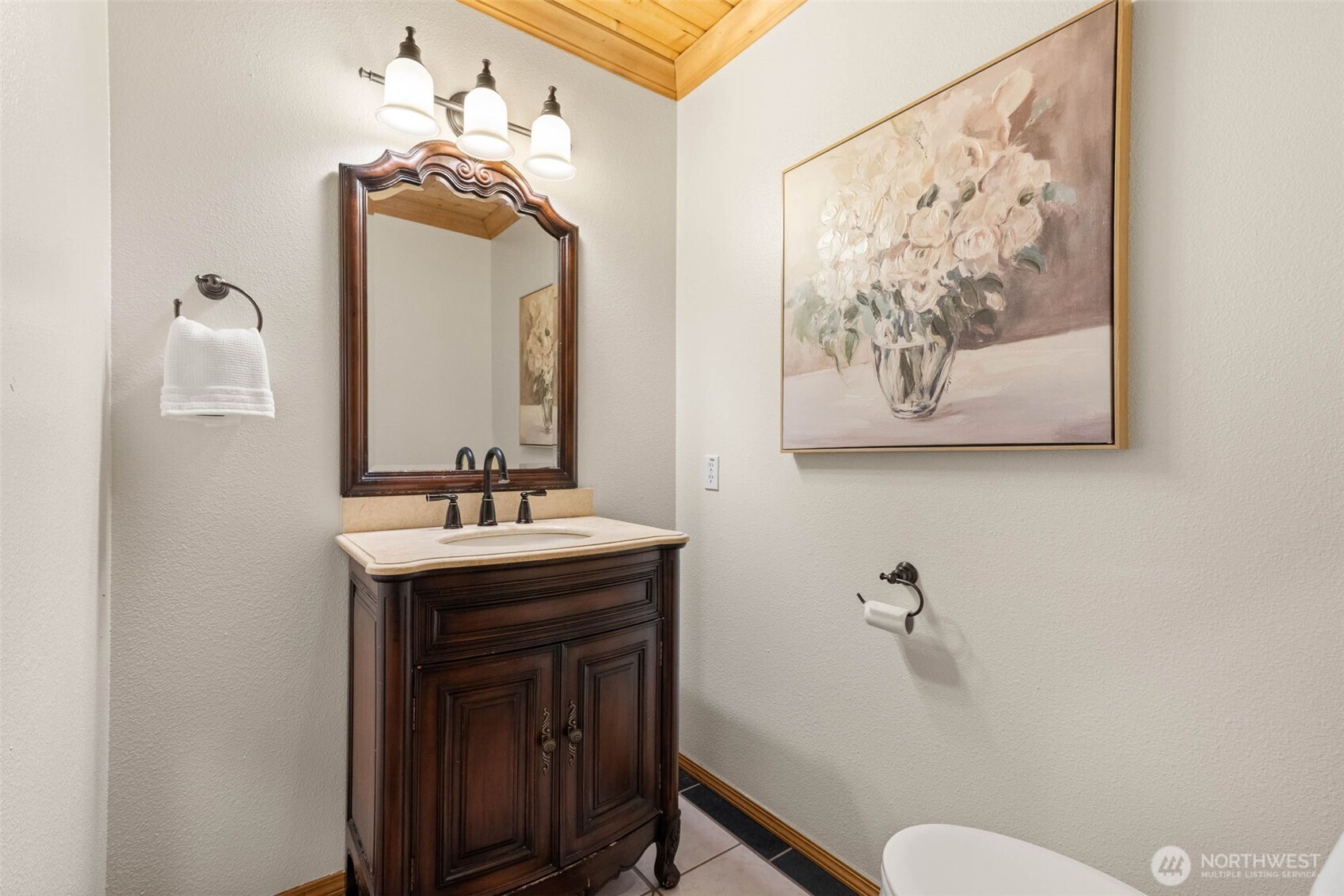 30608 40th Avenue South Roy, WA 98580 - Photo 26 of 40 a bathroom with a toilet a sink and mirror