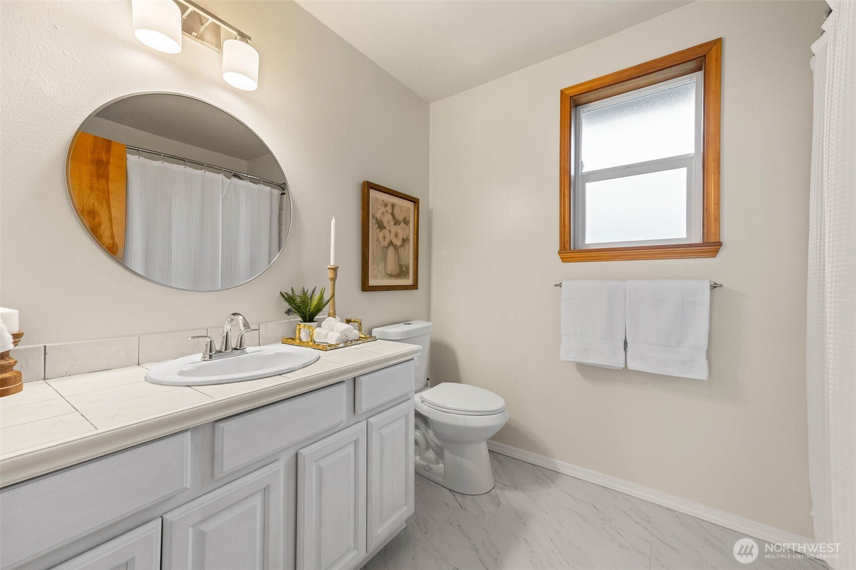 30608 40th Avenue South Roy, WA 98580 - Photo 29 of 40 a bathroom with a toilet sink and mirror