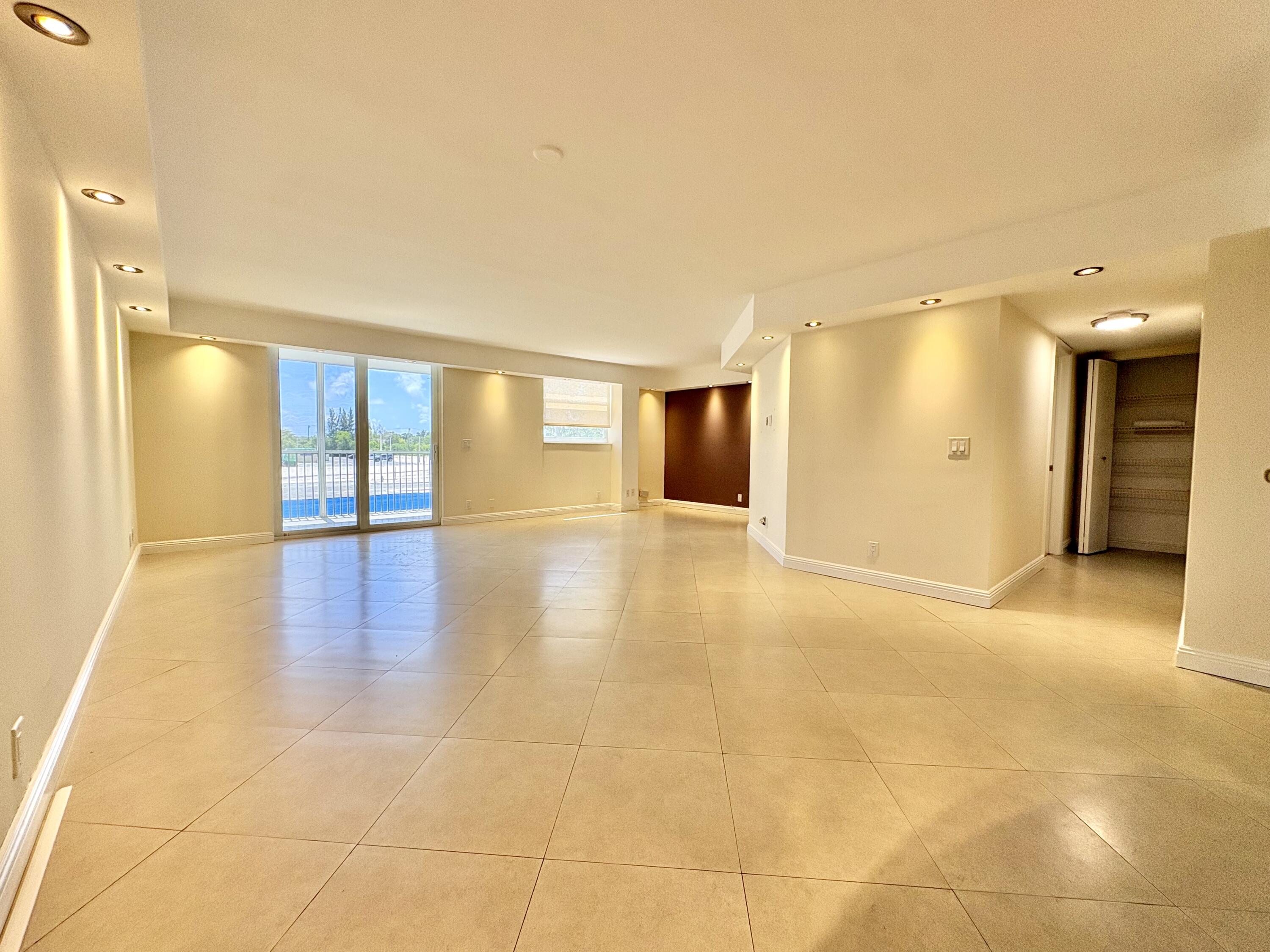 5700 Northwest 2nd Avenue, Unit 203 Boca Raton, FL 33487 - Photo 6 of 29 LIVING AND DINING ROOM