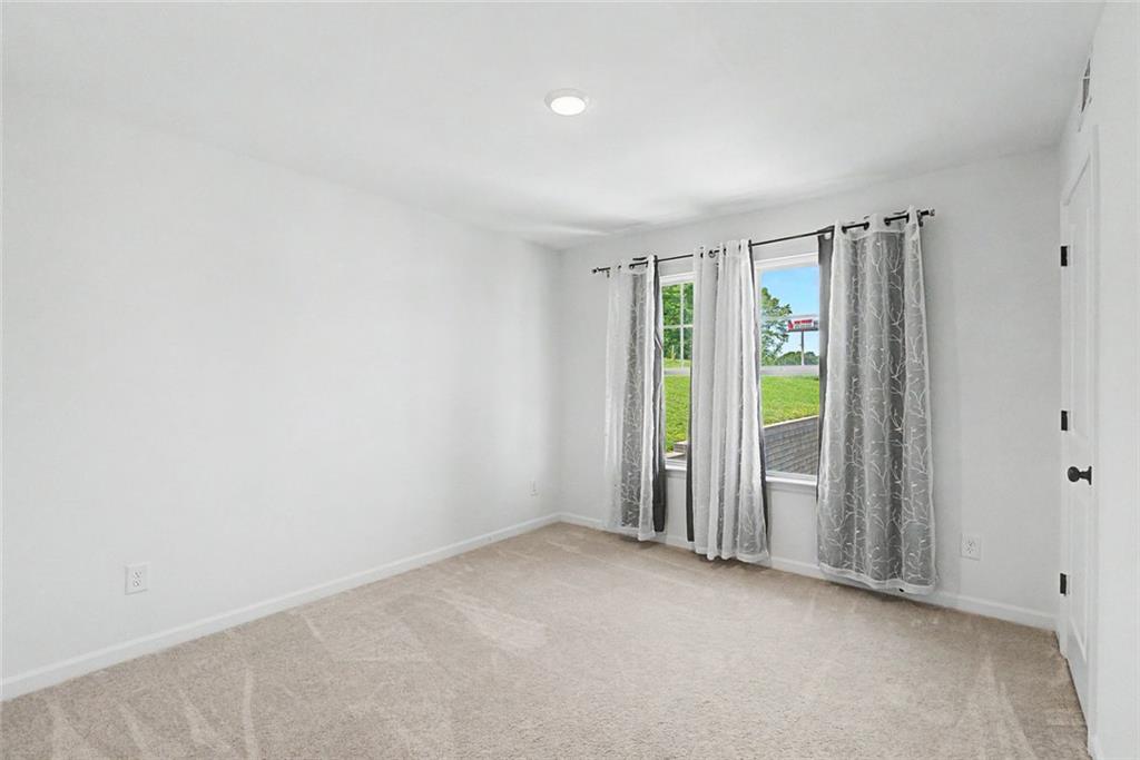 2310 Portrush Way Southeast Atlanta, GA 30339 - Photo 33 of 38 an empty room with closet and a window