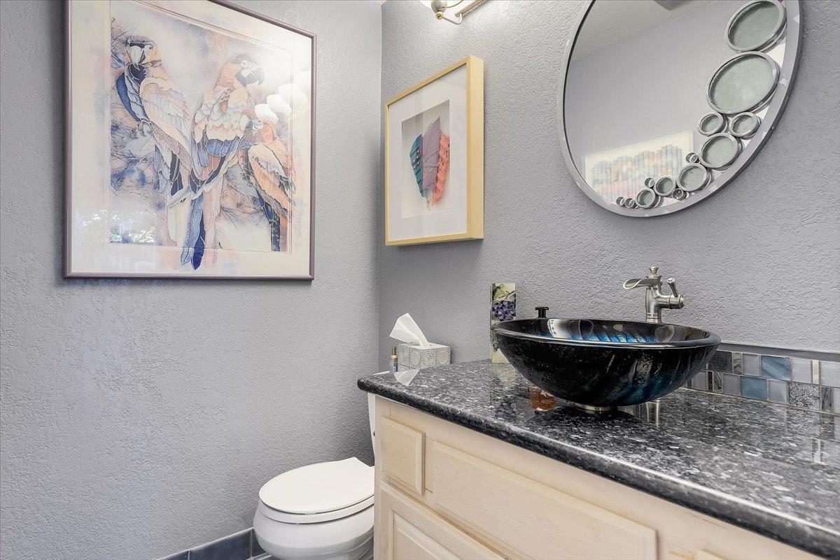 1635 Serpa Drive Milpitas, CA 95035 - Photo 16 of 31 a bathroom with a granite countertop sink mirror and vanity