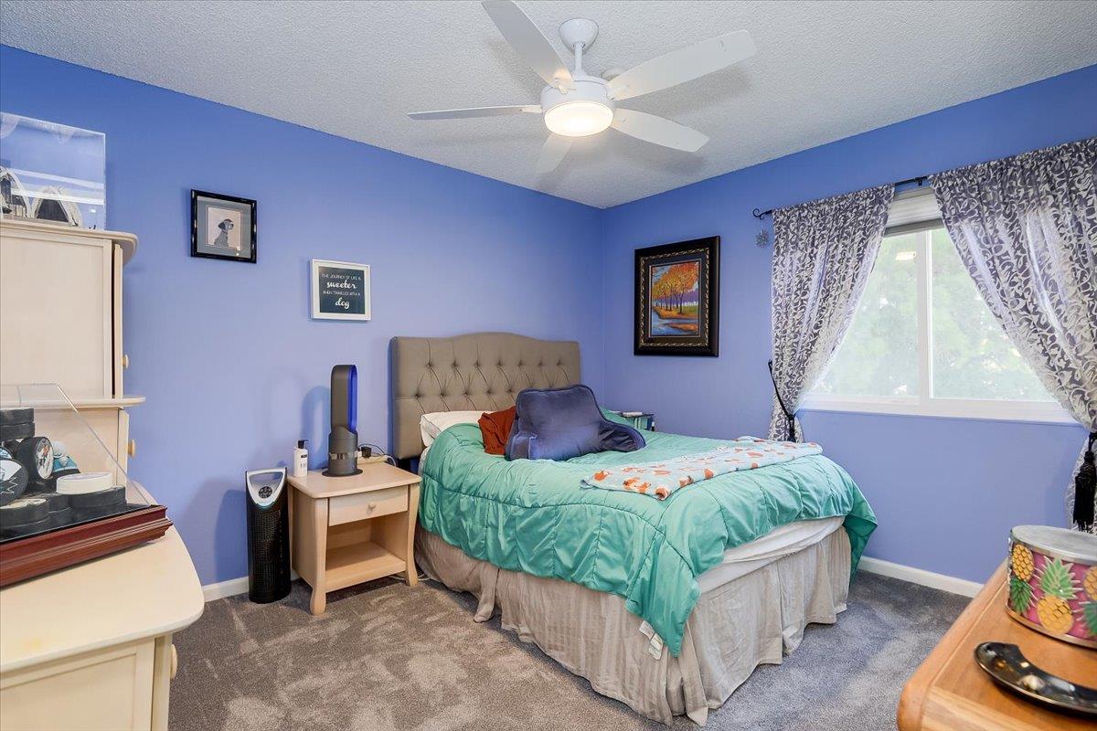 1635 Serpa Drive Milpitas, CA 95035 - Photo 19 of 31 a bedroom with a bed and a couch