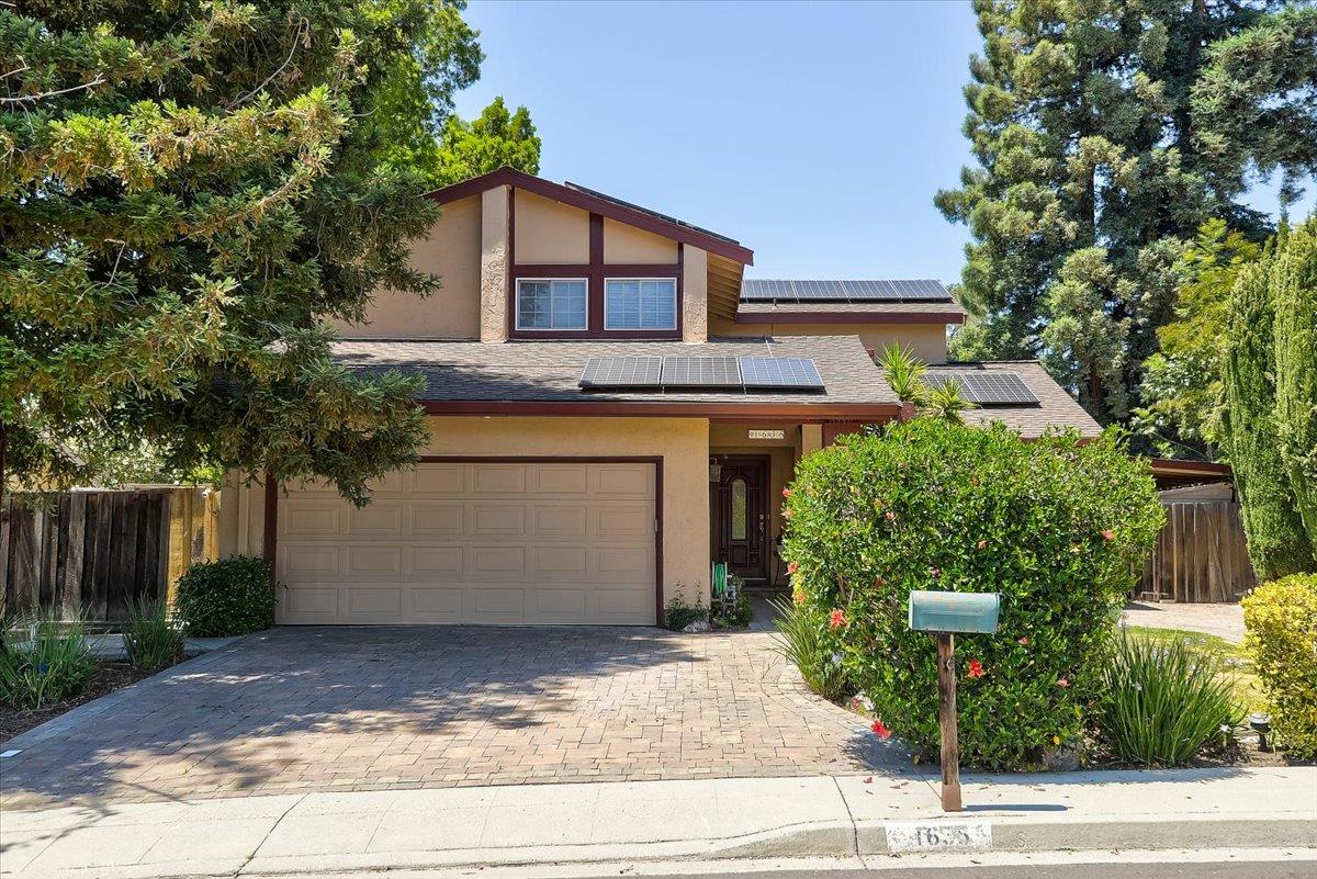 1635 Serpa Drive Milpitas, CA 95035 - Photo 2 of 31 a front view of a house with a yard and garage