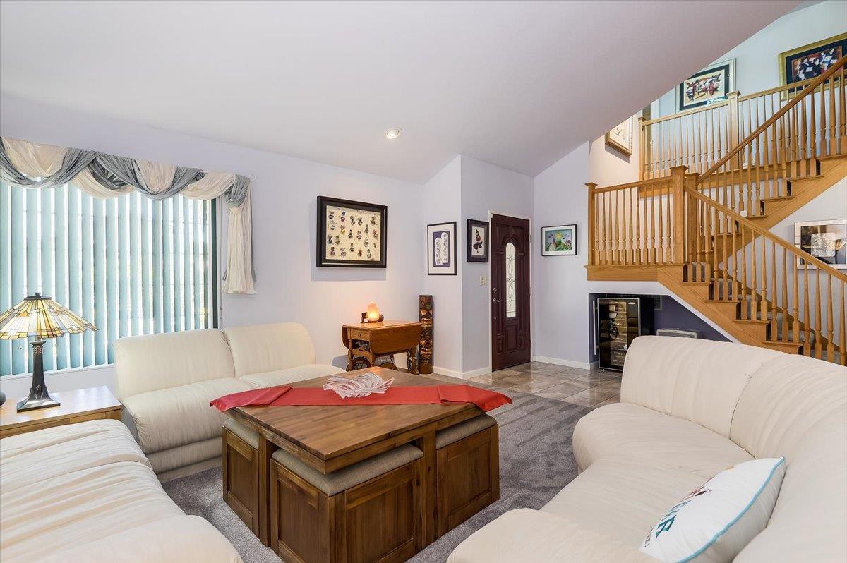 1635 Serpa Drive Milpitas, CA 95035 - Photo 5 of 31 a living room with furniture a flat screen tv and a couch