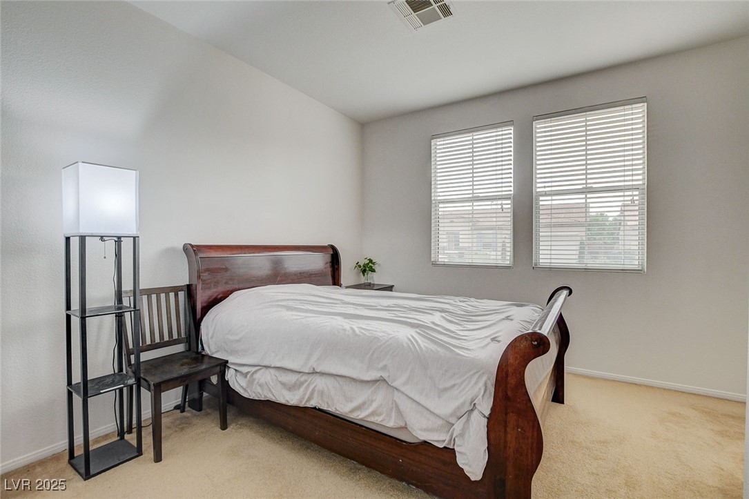 7427 Wagonwheel Ranch Way Las Vegas, NV 89113 - Photo 18 of 50 Carpeted bedroom with baseboards