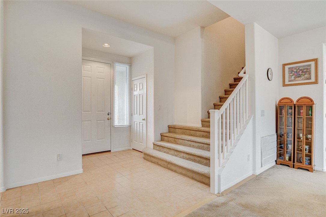 7427 Wagonwheel Ranch Way Las Vegas, NV 89113 - Photo 24 of 50 Foyer entrance featuring stairs and recessed lighting