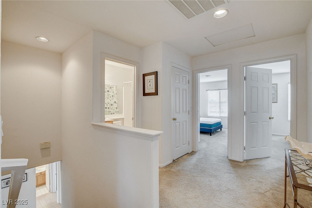 7427 Wagonwheel Ranch Way Las Vegas, NV 89113 - Photo 26 of 50 Hall with attic access, light carpet, and recessed lighting