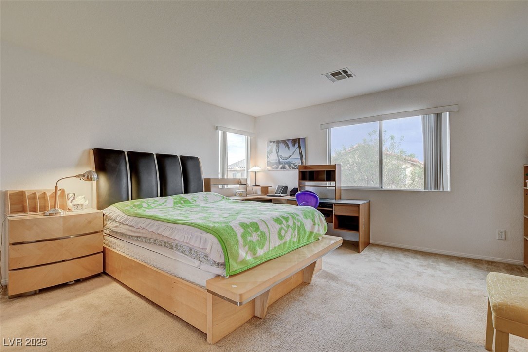 7427 Wagonwheel Ranch Way Las Vegas, NV 89113 - Photo 30 of 50 Bedroom featuring light carpet