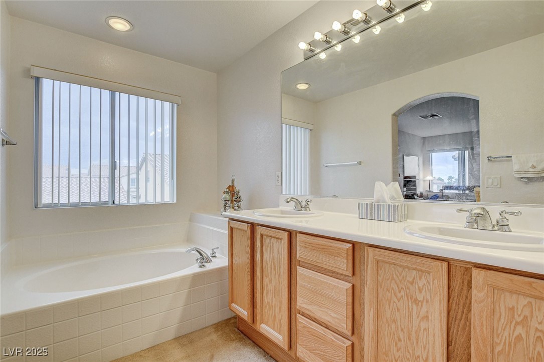 7427 Wagonwheel Ranch Way Las Vegas, NV 89113 - Photo 34 of 50 Full bath featuring double vanity and a garden tub