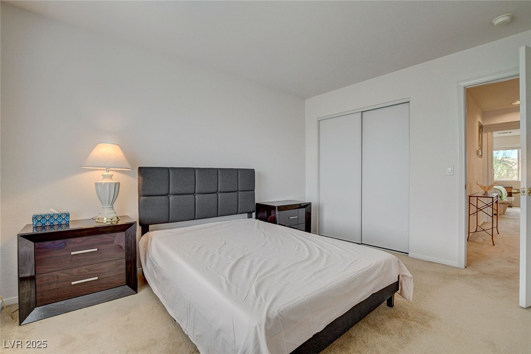 7427 Wagonwheel Ranch Way Las Vegas, NV 89113 - Photo 37 of 50 Bedroom with light carpet and a closet