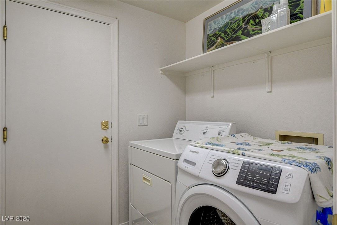 7427 Wagonwheel Ranch Way Las Vegas, NV 89113 - Photo 43 of 50 Washroom with washing machine and clothes dryer