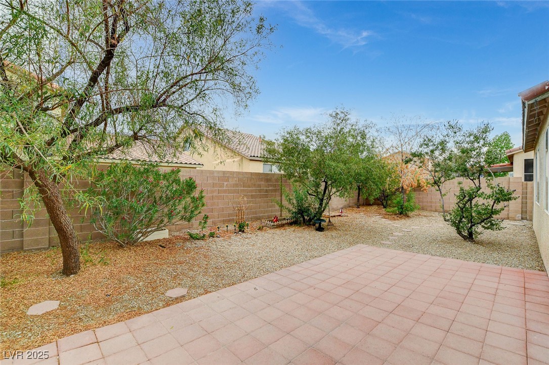 7427 Wagonwheel Ranch Way Las Vegas, NV 89113 - Photo 44 of 50 Fenced backyard with a patio area