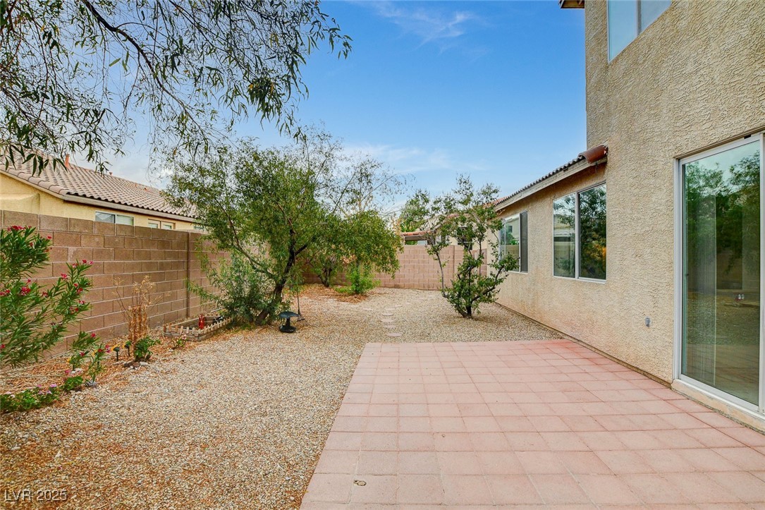7427 Wagonwheel Ranch Way Las Vegas, NV 89113 - Photo 45 of 50 Fenced backyard with a patio area