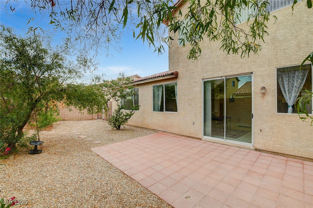 7427 Wagonwheel Ranch Way Las Vegas, NV 89113 - Photo 46 of 50 Fenced backyard featuring a patio area