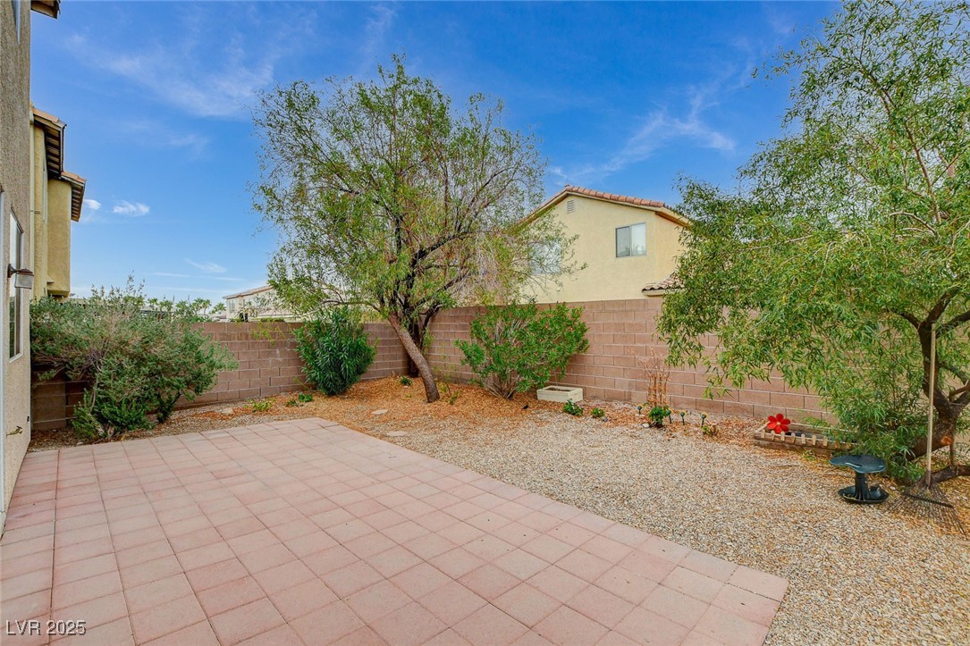7427 Wagonwheel Ranch Way Las Vegas, NV 89113 - Photo 48 of 50 Fenced backyard with a patio