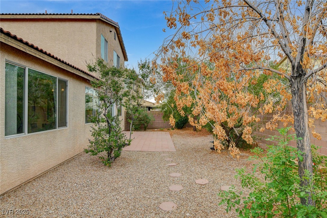 7427 Wagonwheel Ranch Way Las Vegas, NV 89113 - Photo 50 of 50 Fenced backyard featuring a patio area