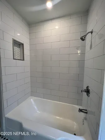 a close up of a bathtub in a bathroom