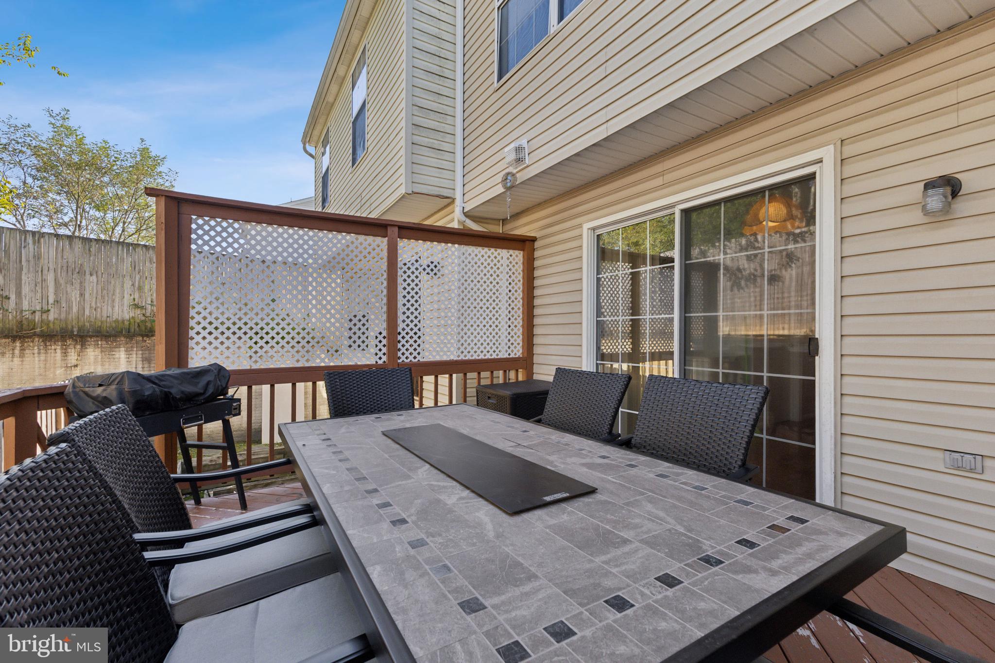 207 Wimbeldon Court, Unit 210 Stafford, VA 22556 - Photo 24 of 38 Private deck/fresh paint, table and chairs convey