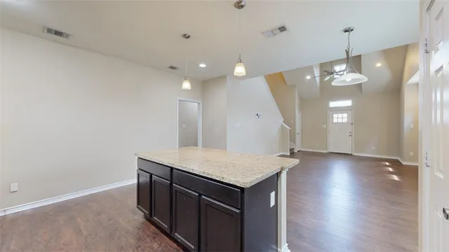 a picture of a bench in front of a wall