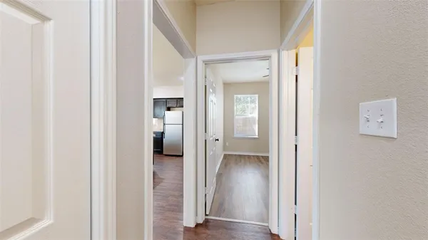 wooden floor with white walls