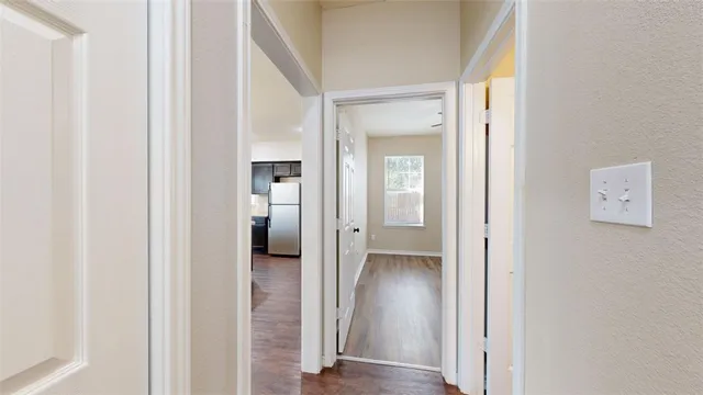 wooden floor with white walls