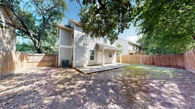 a view of house with backyard