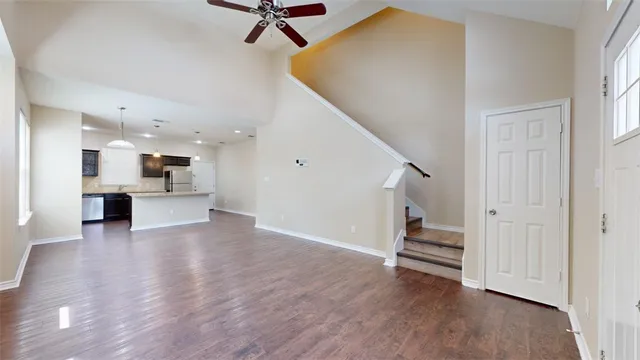 a view of a kitchen and wooden floor