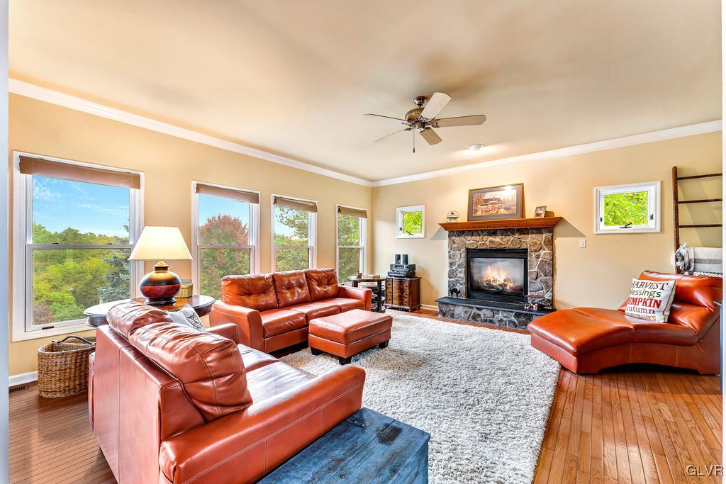 131 Blackstone Drive Wind Gap, PA 18091 - Photo 14 of 50 a living room with furniture a fireplace and a floor to ceiling window