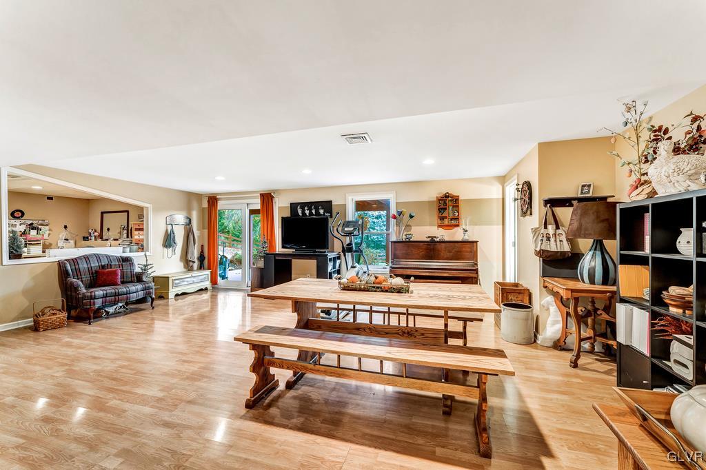 131 Blackstone Drive Wind Gap, PA 18091 - Photo 38 of 50 a living room with furniture a flat screen tv and a table