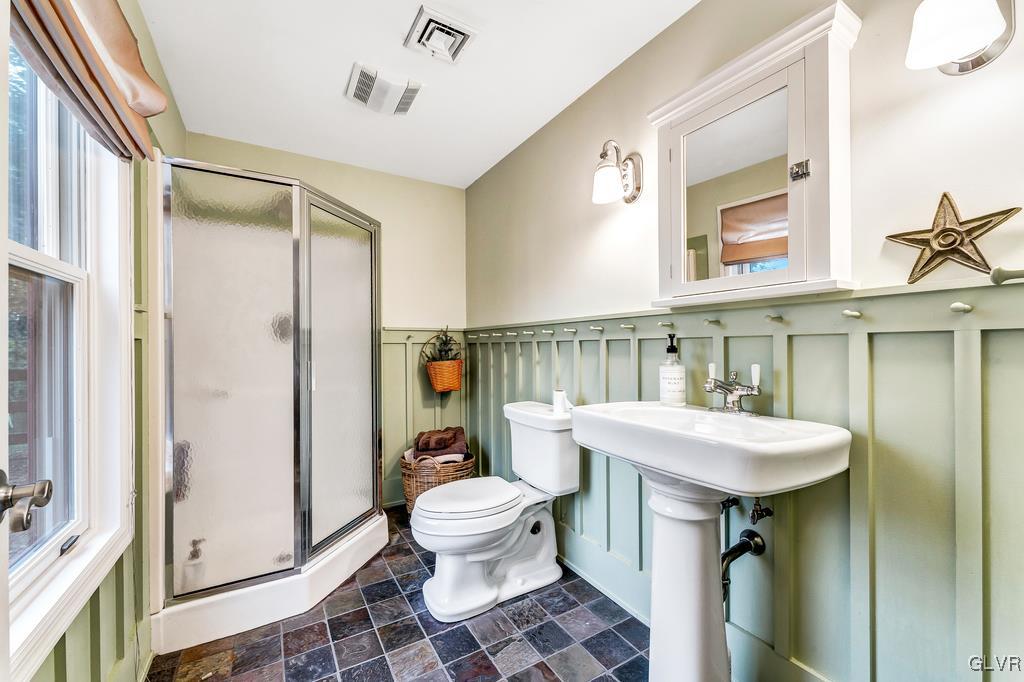131 Blackstone Drive Wind Gap, PA 18091 - Photo 40 of 50 a spacious bathroom with a sink a toilet a mirror and shower