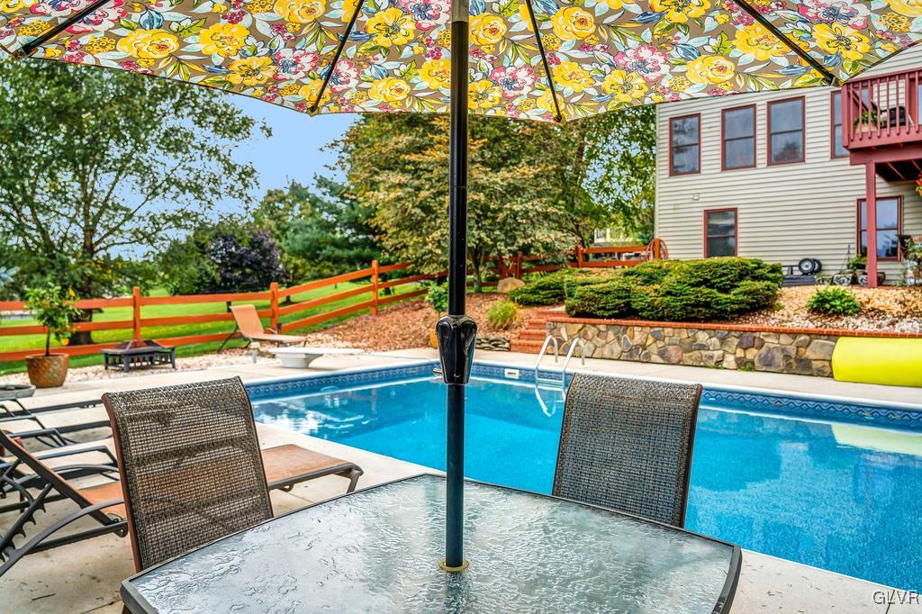 131 Blackstone Drive Wind Gap, PA 18091 - Photo 48 of 50 a view of a swimming pool with a lounge chairs
